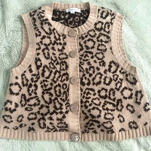 See by Chloe, Cheetah print sleeveless button down sweater with v neckline.